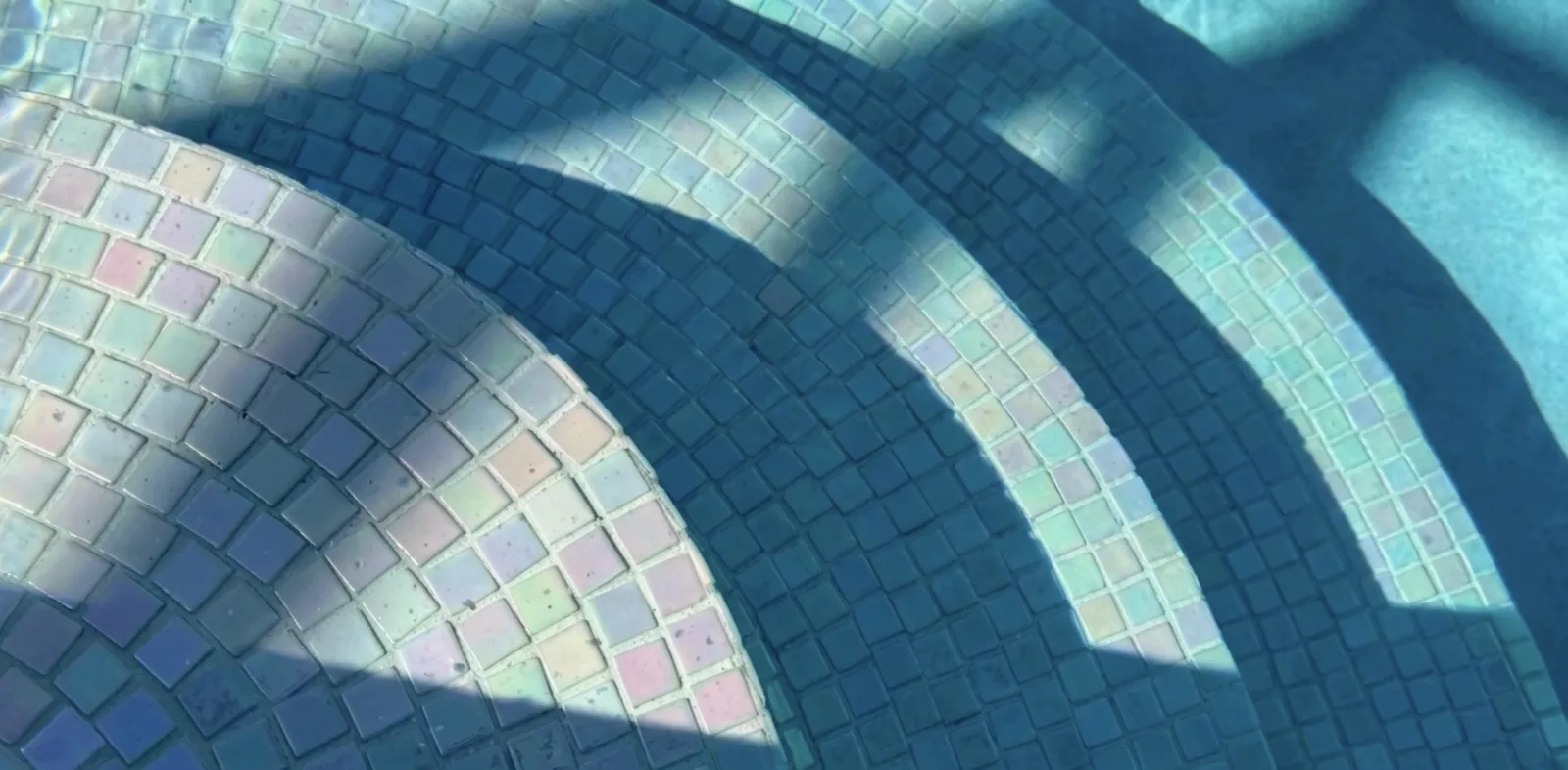 Glass mosaic pool finish — water detail | FDS Pools